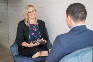 Man discussing wills & estate options with a lawyer